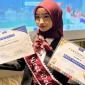 Radya Nasywa Zahira, mahasiswi Fakultas Psikologi UGM, menunjukkan sertifikat penghargaan usai terpilih sebagai delegasi fully funded dalam program SMI Youth Exchange 2025 di Singapura, Malaysia, dan Thailand. Dalam ajang tersebut, Radya juga berhasil meraih nominasi Best Delegate. Sumber: SMI Youth Exchange